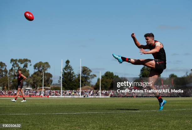 David Myers of the Bombers kicks the ball during the AFL 2018 JLT Community Series match between the Geelong Cats and the Essendon Bombers at Central...