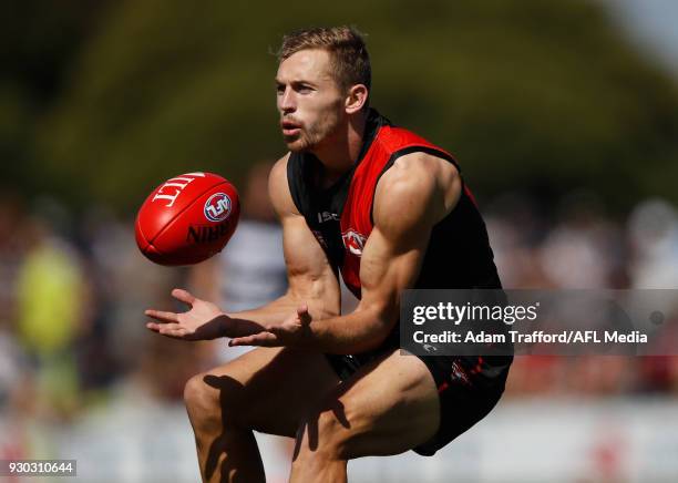 Devon Smith of the Bombers marks the ball during the AFL 2018 JLT Community Series match between the Geelong Cats and the Essendon Bombers at Central...
