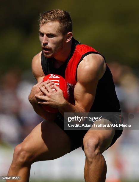 Devon Smith of the Bombers marks the ball during the AFL 2018 JLT Community Series match between the Geelong Cats and the Essendon Bombers at Central...