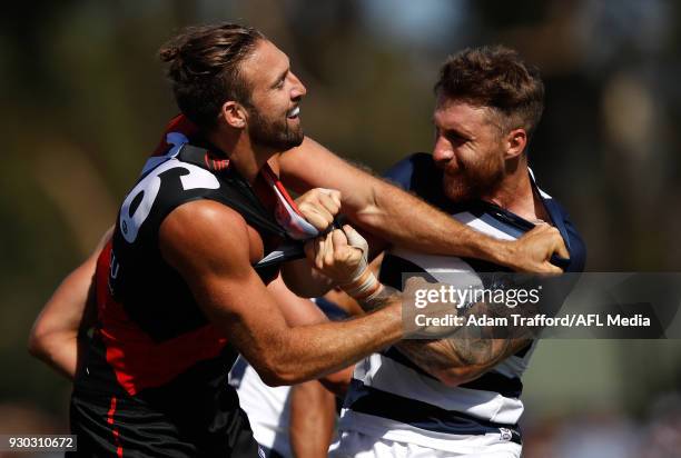 Cale Hooker of the Bombers remonstrates with Zach Tuohy of the Cats during the AFL 2018 JLT Community Series match between the Geelong Cats and the...