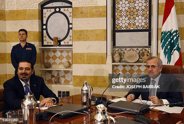 Lebanese Prime Minister Saad Hariri smiles as President Michel Sleiman heads the first meeting of the newly formed cabinet at the presidential palace...