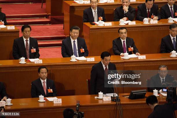 Wang Chen, vice chairman and secretary-general of the National People's Congress , front row second right, speaks as Li Zhanshu, member of the...