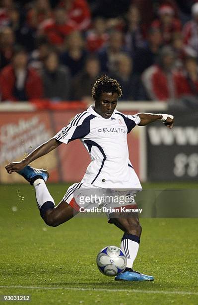 Emmanuel Osei of the New England Revolution kicks the ball against the Chicago Fire during the first half of game 2 of the Eastern Conference...