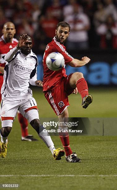 Daniel Woolard of the Chicago Fire kicks the ball against the New England Revolution during the first half of game 2 of the Eastern Conference...