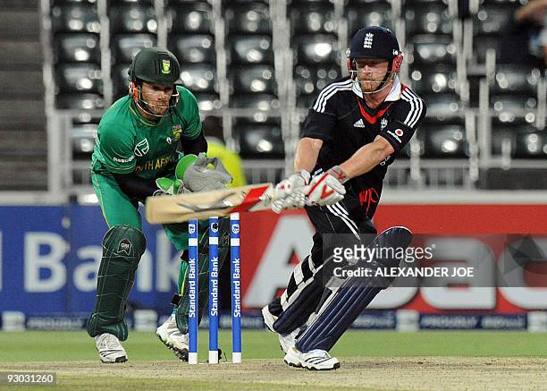England cricketer Paul Collingwood reverse sweeps off the ball of South African cricketer Johan Botha during a Twenty20 match at Wanderers Stadium in...