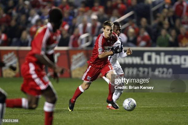 Chris Rolfe of the Chicago Fire moves the ball up the field against the New England Revolution during the second half of game 2 of the Eastern...