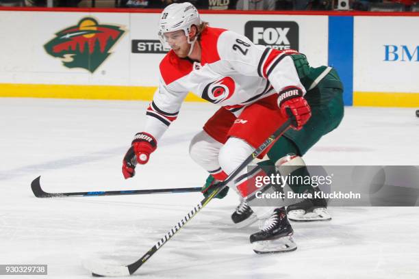 Elias Lindholm of the Carolina Hurricanes skates with the puck against the Minnesota Wild during the game at the Xcel Energy Center on March 6, 2018...