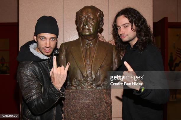 Singers James Carpinello and Constantine Maroulis from "Rock of Ages" visit PS/IS 111 on November 13, 2009 in New York City.