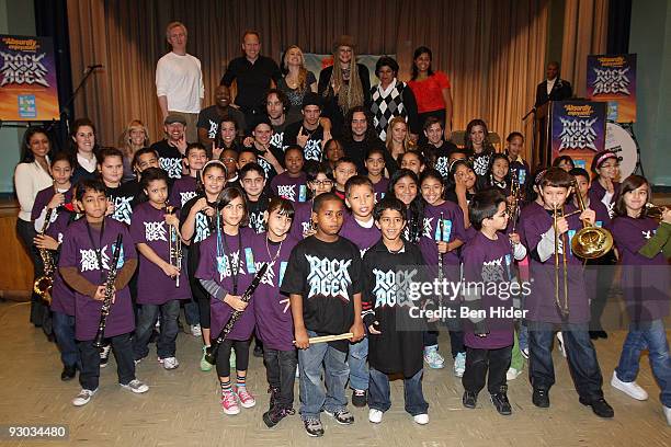 The cast of 'Rock of Ages' pose with school children at PS/IS 111 on November 13, 2009 in New York City.