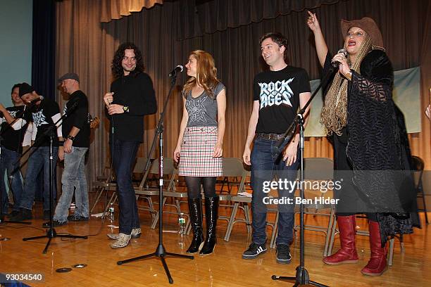 Singers Jeremy Woodard, James Carpinello, Matthew Stocke, Constantine Maroulis, Tom Lenk and Michelle Mais of "Rock of Ages" perform at PS/IS 111 on...