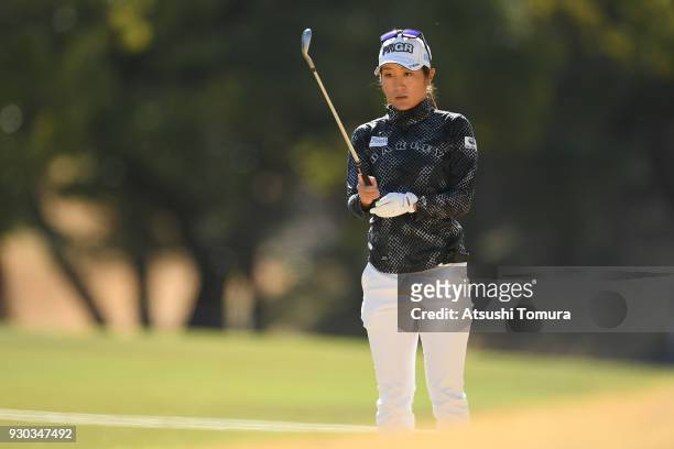 Asako Fujimoto of Japan lines up her second shot on the 1st hole during the final round of the Tokohama Tire PRGR Ladies Cup at Tosa Country Club on...