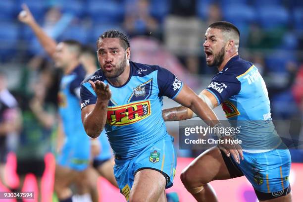 Konrad Hurrell of the Titans celebrates after scoring a try to win the round one NRL match between the Gold Coast Titans and the Canberra Raiders at...