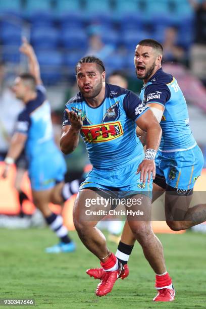 Konrad Hurrell of the Titans celebrates after scoring a try to win the round one NRL match between the Gold Coast Titans and the Canberra Raiders at...