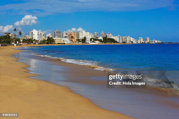 buildings at the waterfront, condado beach, san juan, puerto rico - condado beach stock pictures, royalty-free photos & images