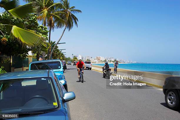 vehicles moving on the road, san juan, puerto rico - condado beach stock pictures, royalty-free photos & images
