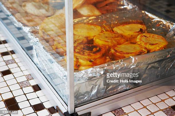 close-up of arepa rellena food in a display cabinet, luquillo, puerto rico - luquillo stock-fotos und bilder