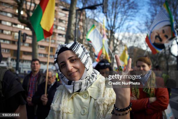 Kurd woman makes the V sign. Kurds demonstrate to pay tribute to French fighter Kendal Breizh killed by turkish forces in Afrin. They also protest...