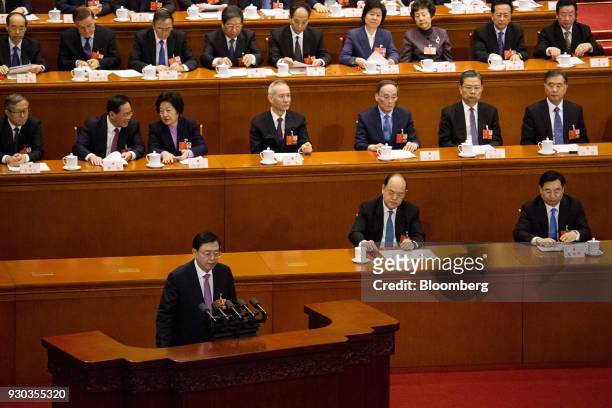 Zhang Dejiang, chairman of the Standing Committee of the National People's Congress , left, following a vote to repeal presidential term limits at a...