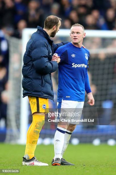 Wayne Rooney of Everton shakes hands with Glenn Murray of Brighton and Hove Albion following the Premier League match between Everton and Brighton...