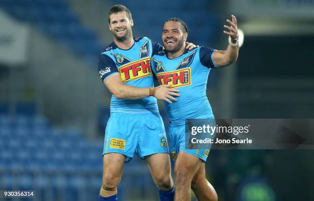 Anthony Don and Konrad Hurrell of the Titans celebrate the win during the round one NRL match between the Gold Coast Titans and the Canberra Raiders...