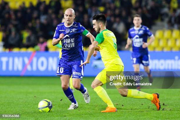 Benjamin Nivet of Troyes and Adrien Thomasson of Nantes during the Ligue 1 match between Nantes and Troyes AC at Stade de la Beaujoire on March 10,...