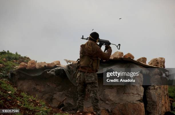 Free Syrian Army member opens fire with a machine gun loaded on a truck after Turkish Armed Forces and FSA members cleared Khalidiah village in the...