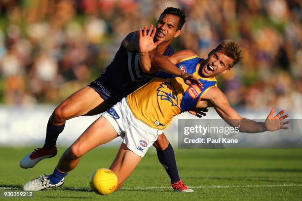 Danyle Pearce of the Dockers and Mark LeCras of the Eagles contest for the ball during the JLT Community Series AFL match between the Fremantle...