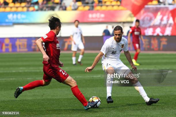 Mario Suarez of Guizhou Hengfeng and Ren Hang of Hebei China Fortune vie for the ball during the 2018 Ping An Chinese Football Association Super...