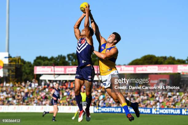 Danyle Pearce of the Dockers competes for a mark with Tom Barrass of the Eagles during the AFL 2018 JLT Community Series match between the Fremantle...