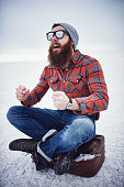 hyped up hobo like hipster with manly awesome beard and sunglasses