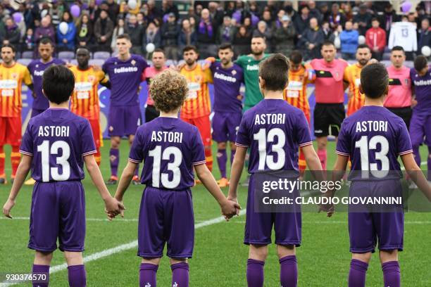 Children wear N°13 jerseys as players and supporters pay tribute to late Fiorentina's captain Davide Astori on March 11, 2018 during the Italian...