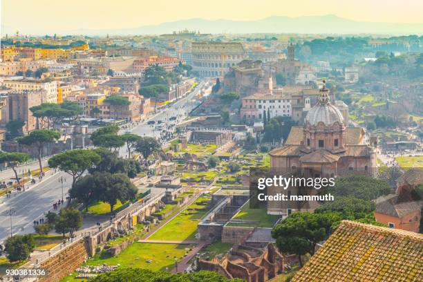 rome cityscape with the colosseum in the background - rome italy skyline stock pictures, royalty-free photos & images