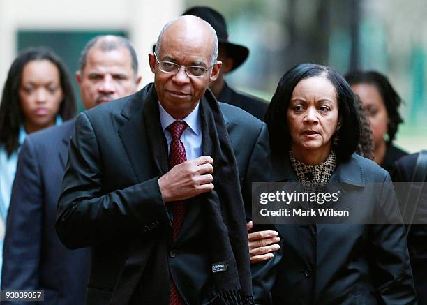 Former Congressman William Jefferson walks with his wife Andrea Jefferson as he arrives at US District Court for his sentencing hearing on November...