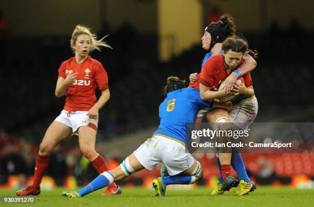 Wales Alisha Butchers is tackled by Italys Melissa Bettoni and Elisa Giordano during the Women's Six Nations Championship match between Wales Women...