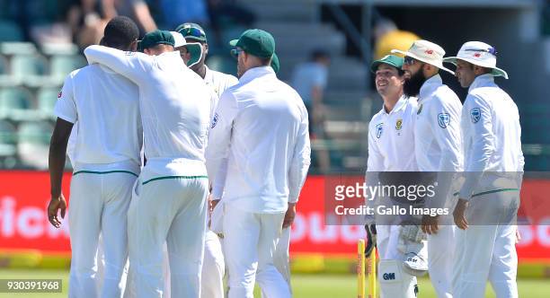 Kagiso Rabada and team mates of South Africa celebrate the wicket of David Warner of Australia during day 3 of the 2nd Sunfoil Test match between...