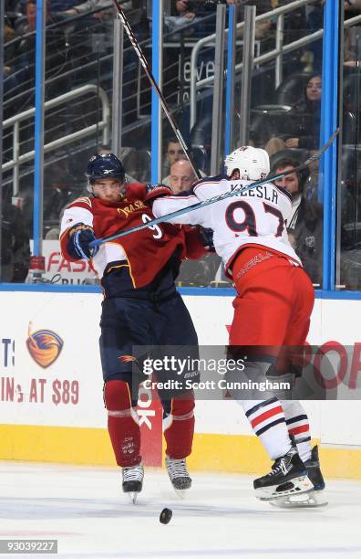 Rostislav Klesla of the Columbus Blue Jackets defends against Evander Kane of the Atlanta Thrashers at Philips Arena on November 5, 2009 in Atlanta,...