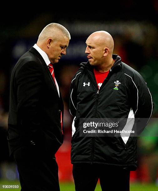Wales head coach Warren Gatland and assistant Shaun Edwards look on as the players warm up during the Autumn International match between Wales and...