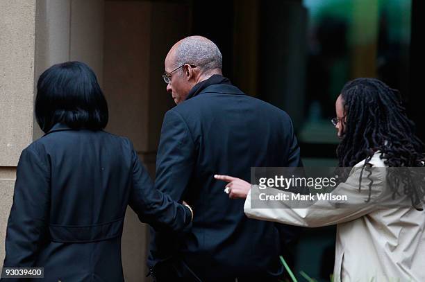 Former Congressman William Jefferson walks with his wife Andrea Jefferson as they arrive at US District Court for his sentencing hearing on November...