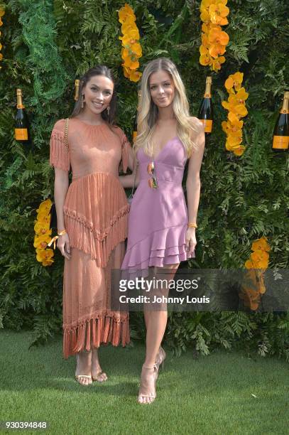 Melody de la Fe and Danielle Knudson are seen at the Veuve Clicquot Fourth Annual Clicquot Carnaval Supporting the Perez Art Museum Miami at Museum...