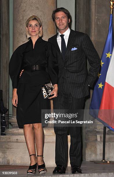 Clotilde Courau and husband Prince Emmanuel Filiberto of Savoy pose as they arrive at the Elysee Palace where U.S Actor Clint Eastwood will receive...