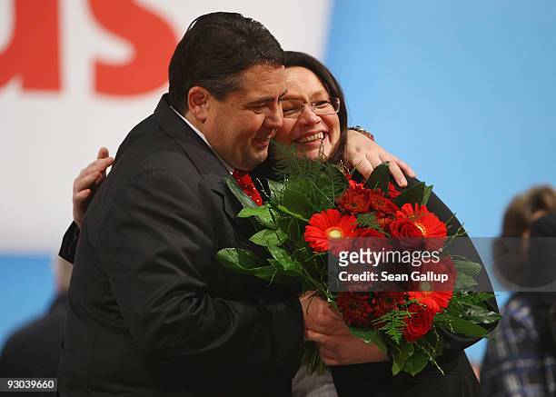 Sigmar Gabriel, new Chairman of the German Social Democratic Party , embraces Andrea Nahles moments after she was elected SPD General Secretary at...