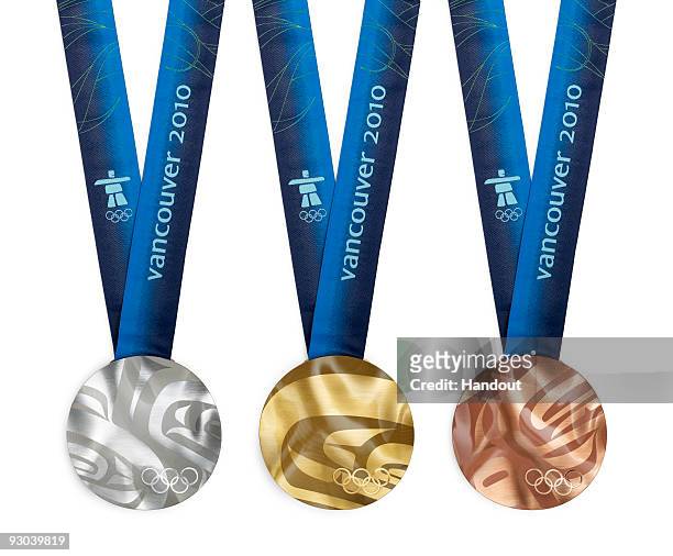 The medals of the Vancouver 2010 Olympic Winter Games are circular in shape and based on a large master artwork of an orca whale by Corrine Hunt, a...