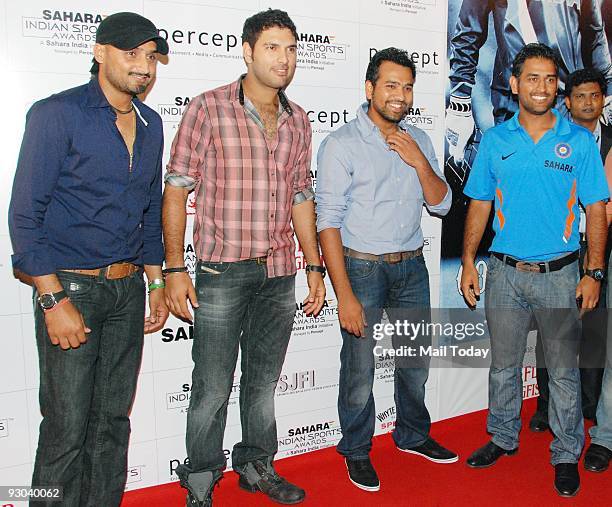 Cricketers Harbhajan Singh;Yuvraj Singh with Mahendra Singh Dhoni at the Sahara Sports Awards gala on Monday, November 9, 2009 in Mumbai.