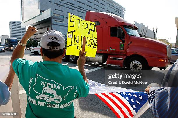 Truck drives near City Hall to protest shipping container fees being assessed against independent truckers as part of the ports' Clean Truck Program...