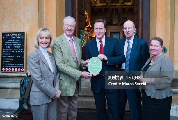 Conservative Leader David Cameron presents John Spencer-Chruchill, 11th Duke of Marlborough with a Green Tourism award, beside Penelope, Viscountess...