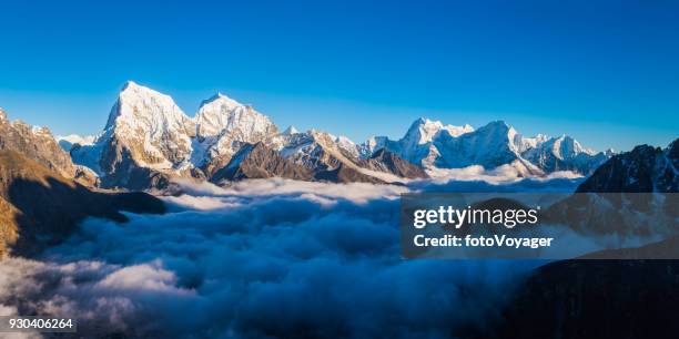 himalayan mountain peaks panorama soaring above the clouds khumbu nepal - gokyo valley stock pictures, royalty-free photos & images