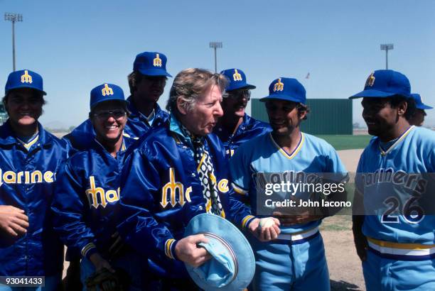 Portrait of Seattle Mariners owner Danny Kaye with players during spring training at Tempe Diablo Stadium. Kaye was an actor, singer, and comedian....