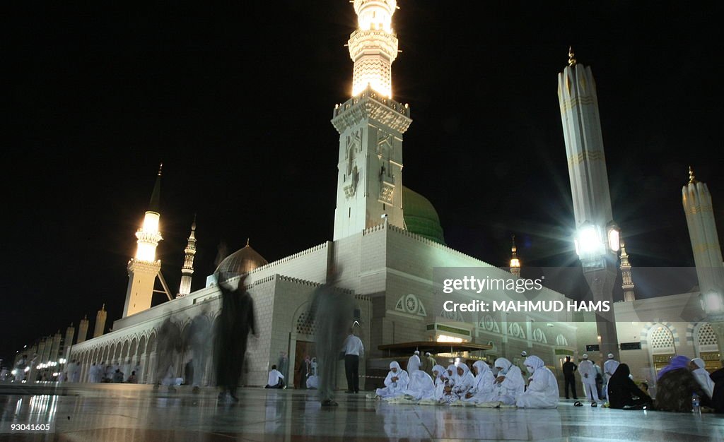 Muslim women pray in the courtyard of th