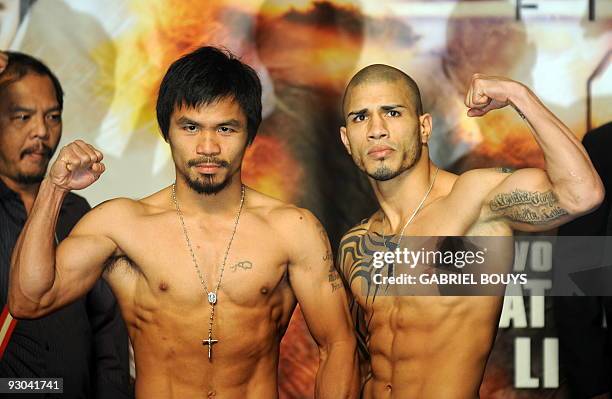 Welterweight boxing champion Manny "PacMan" Pacquiao of the Philippines poses during the official weigh-in for his fight against WBO champion Miguel...