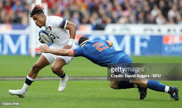 Anthony Watson of England is tackled by Guilhem Guirado during the NatWest Six Nations match between France and England at Stade de France on March...